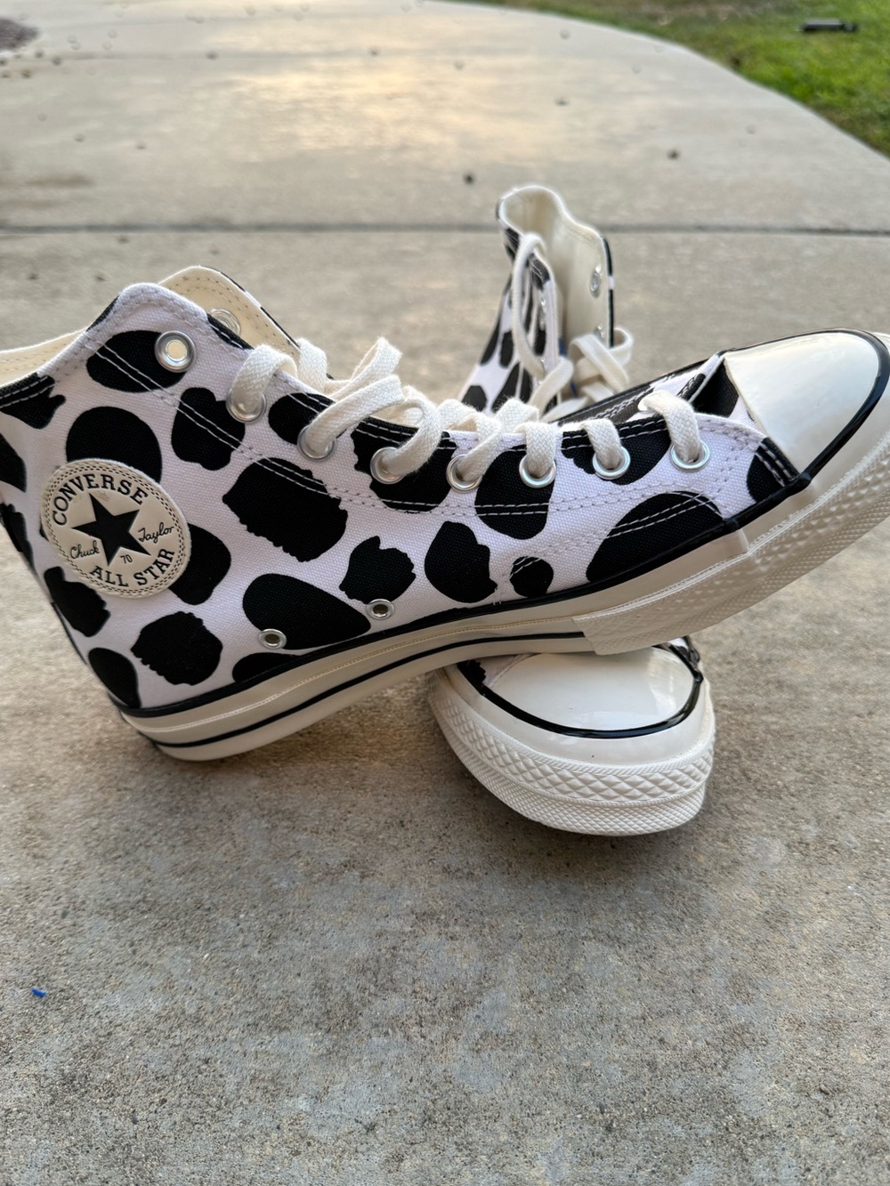 Converse Chuck Taylor Cow print high tops